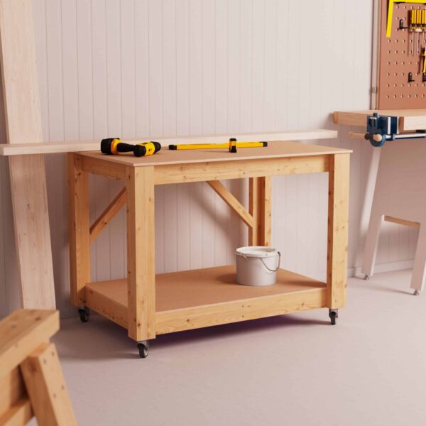 Workbench 120 cm in a workshop. There are tools on the work surface and a paint can on the shelf area of the workbench.